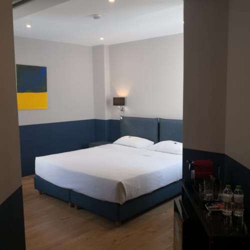 a bedroom with a bed and a table