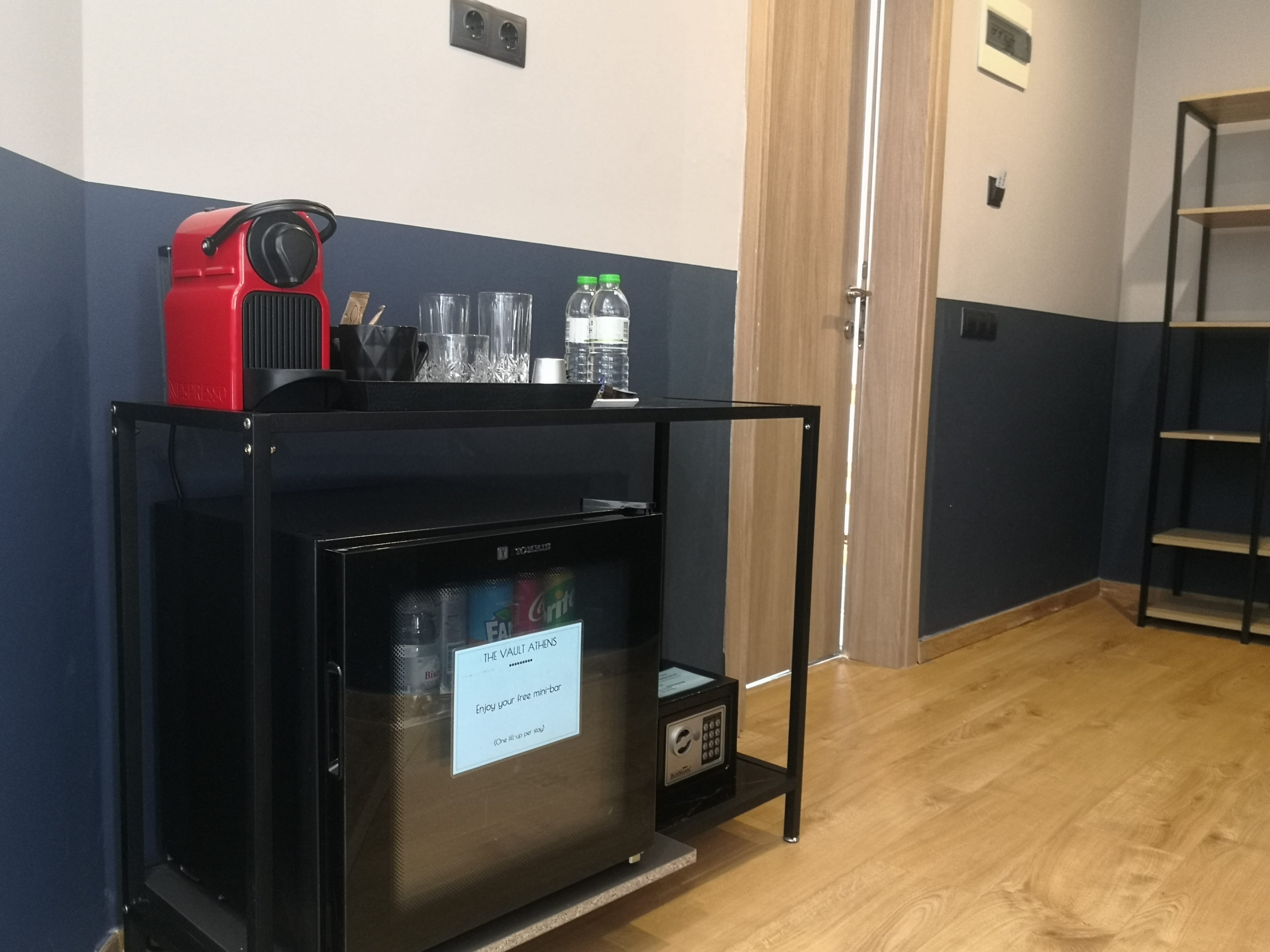 a black machine with a red and white box on top