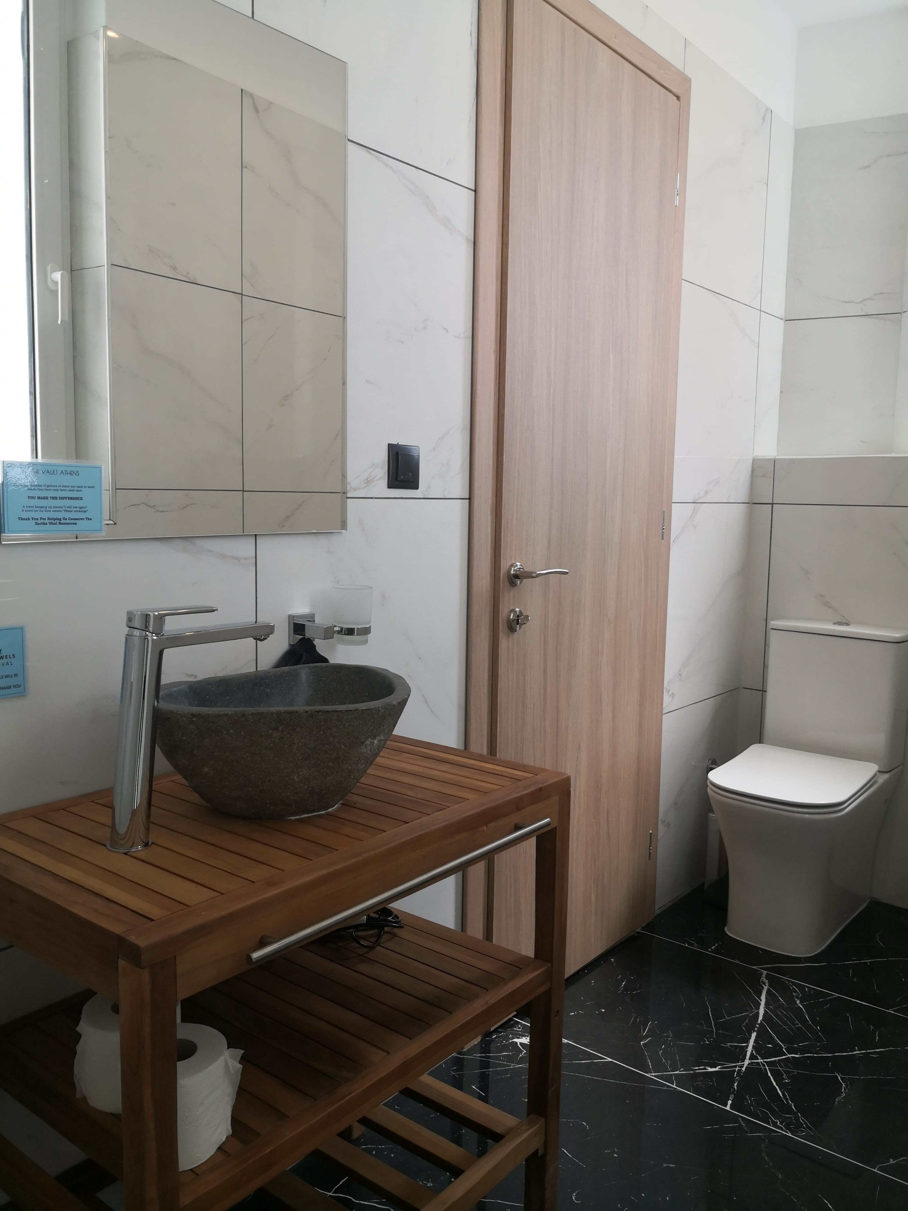 a bathroom with a sink and toilet