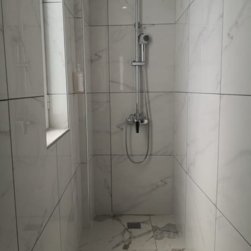 a shower with a glass door