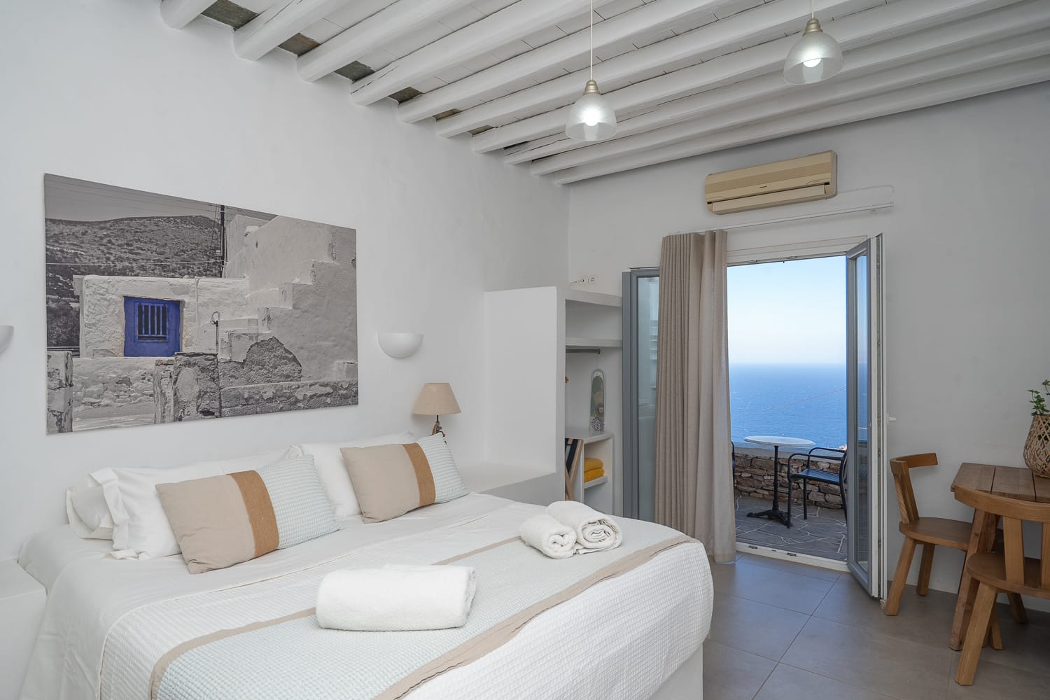 a bedroom with a bed and a door open