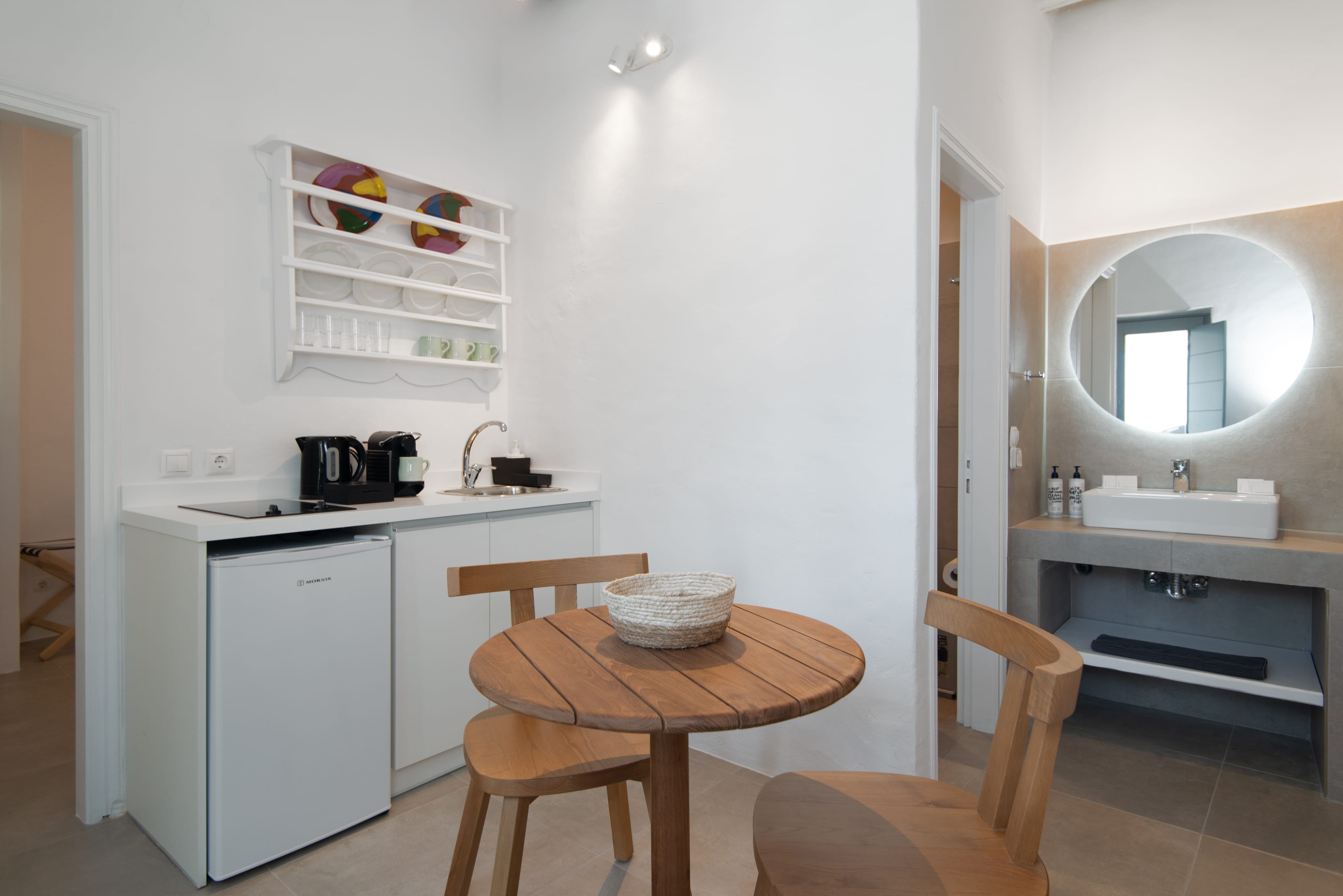 a small kitchen with a table and chairs