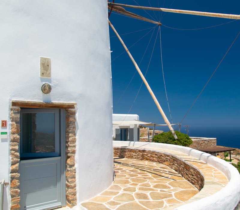 a white building with a blue door