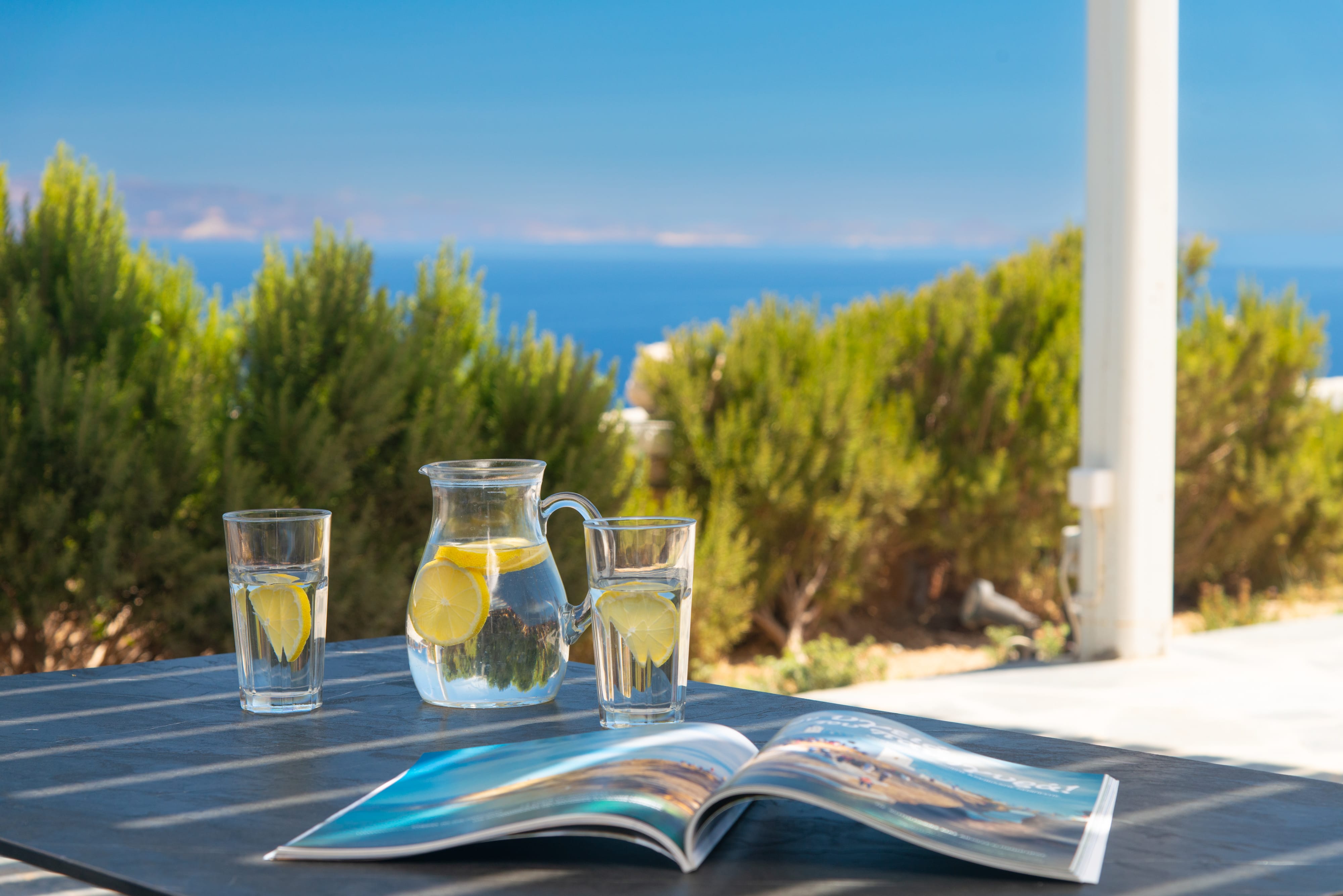a table with glasses of liquid on it and a towel on it