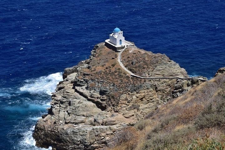 a lighthouse on a rocky cliff