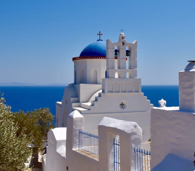 a white building with a blue dome