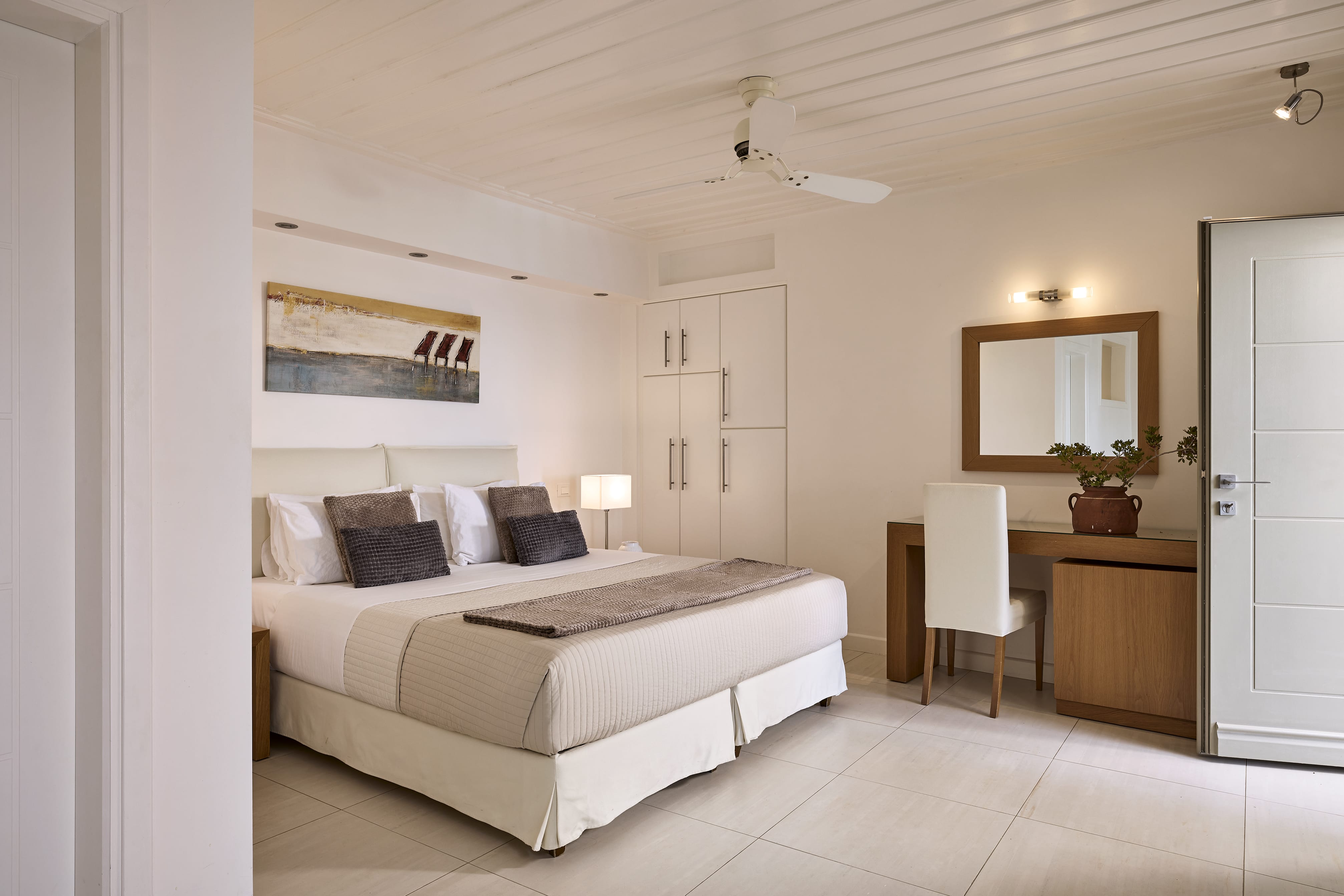 a bedroom with a bed and a desk