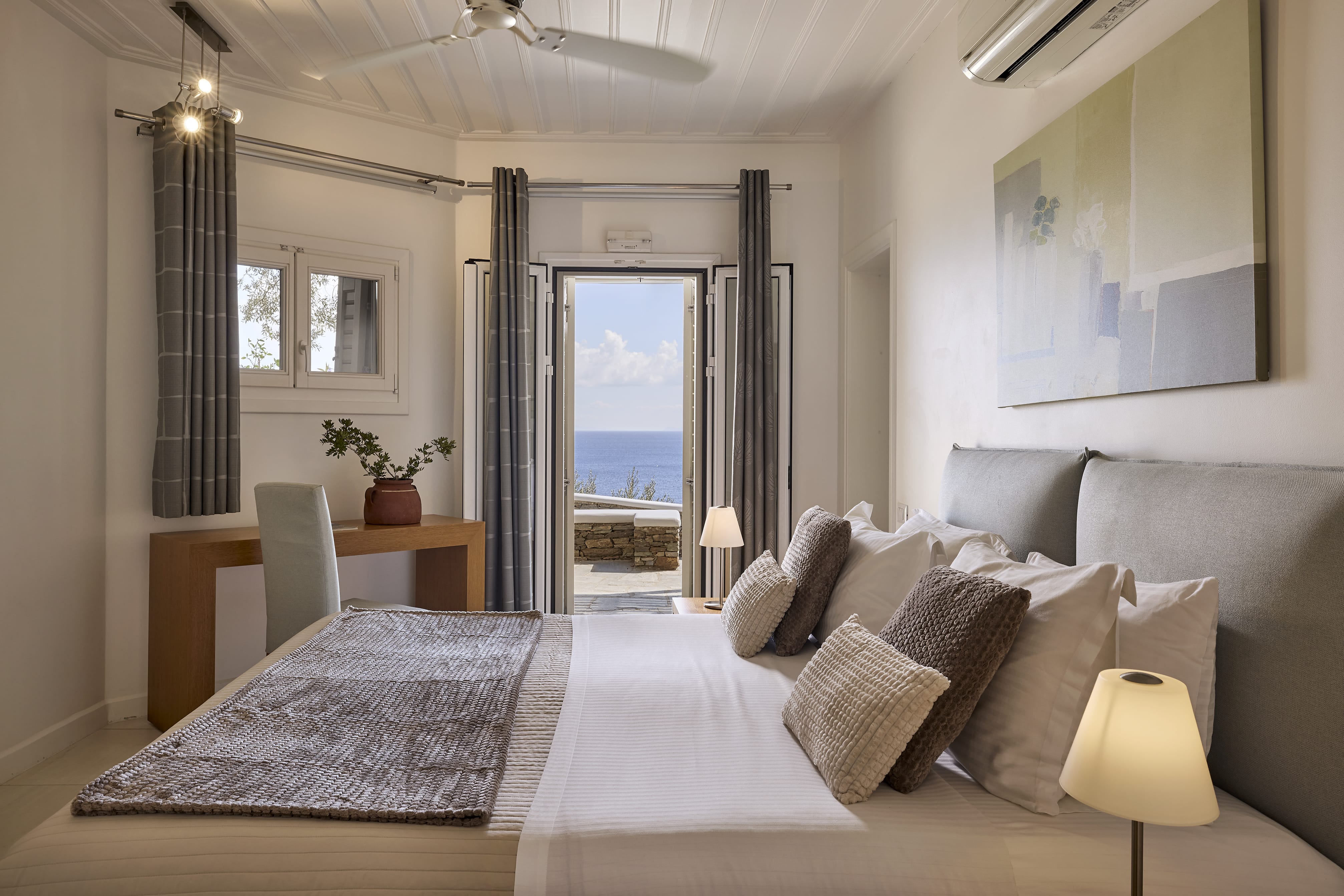 a bedroom with a bed and a mirror