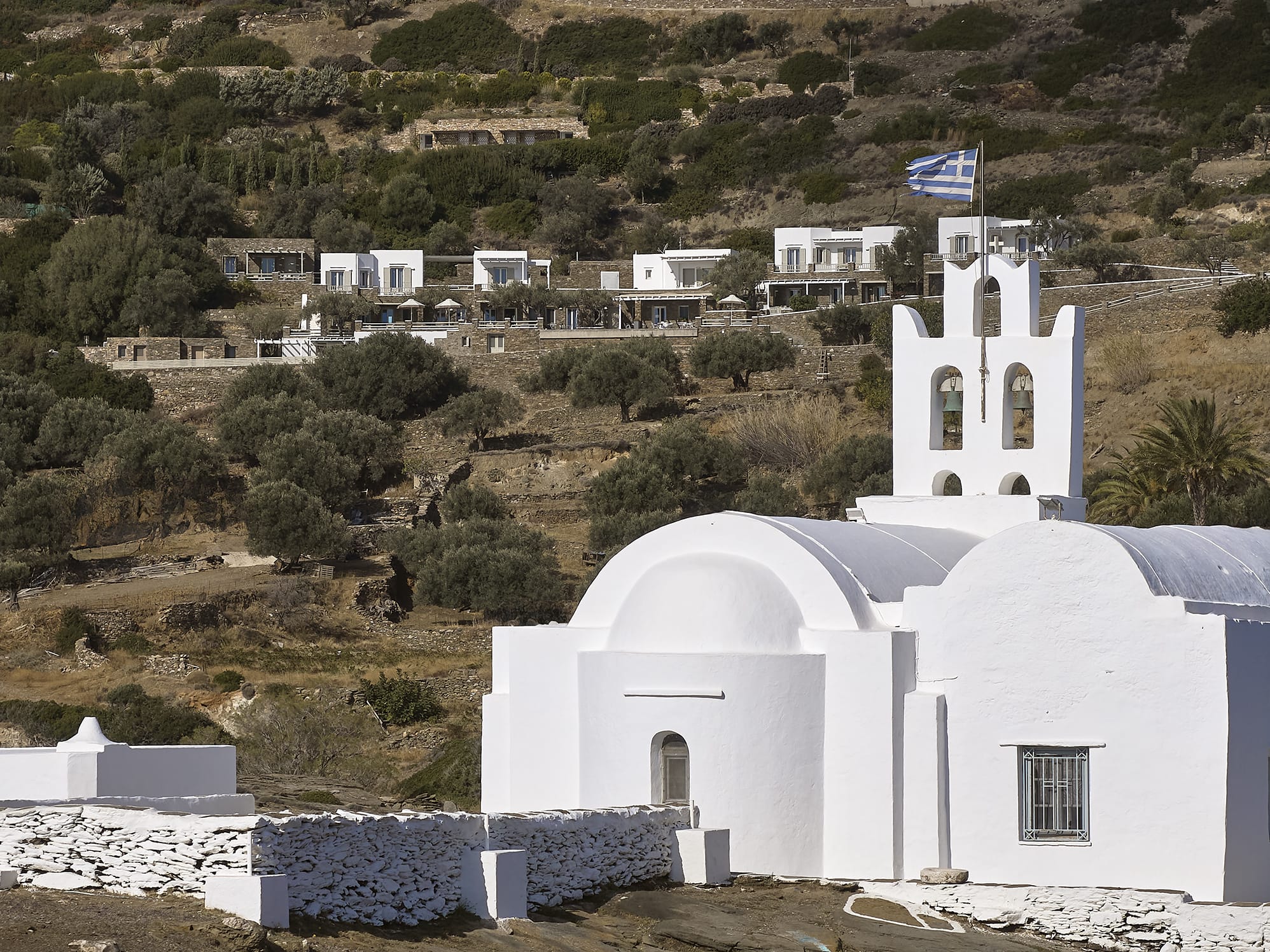 a white building with a flag on top