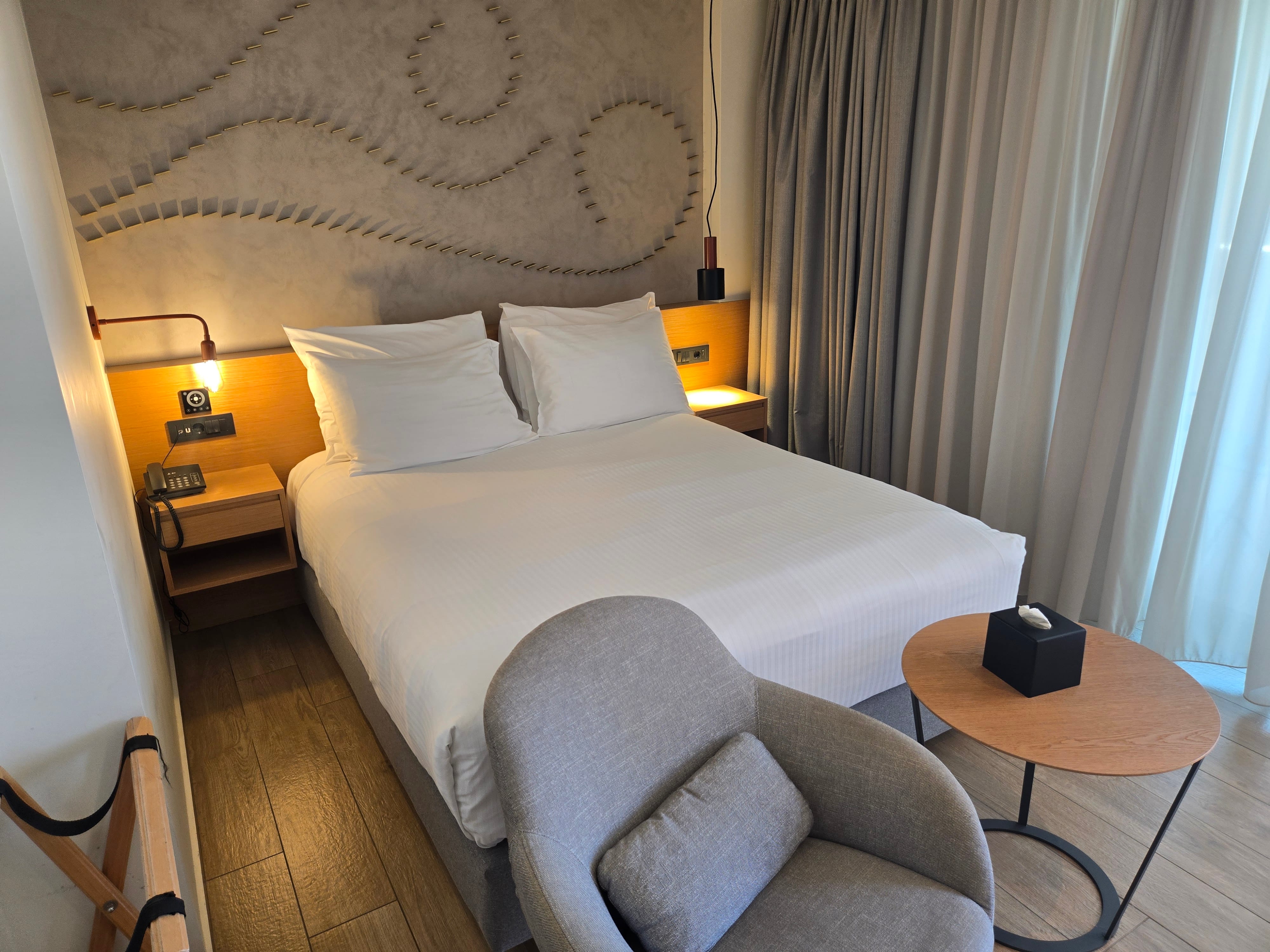 a bed with a chair and a table