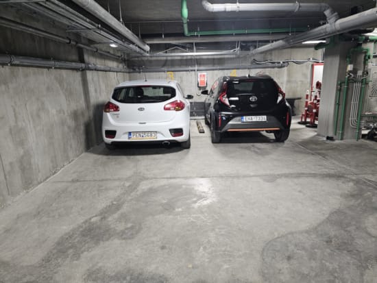 two cars parked in a garage