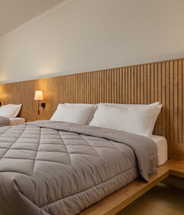 a hotel room with two beds