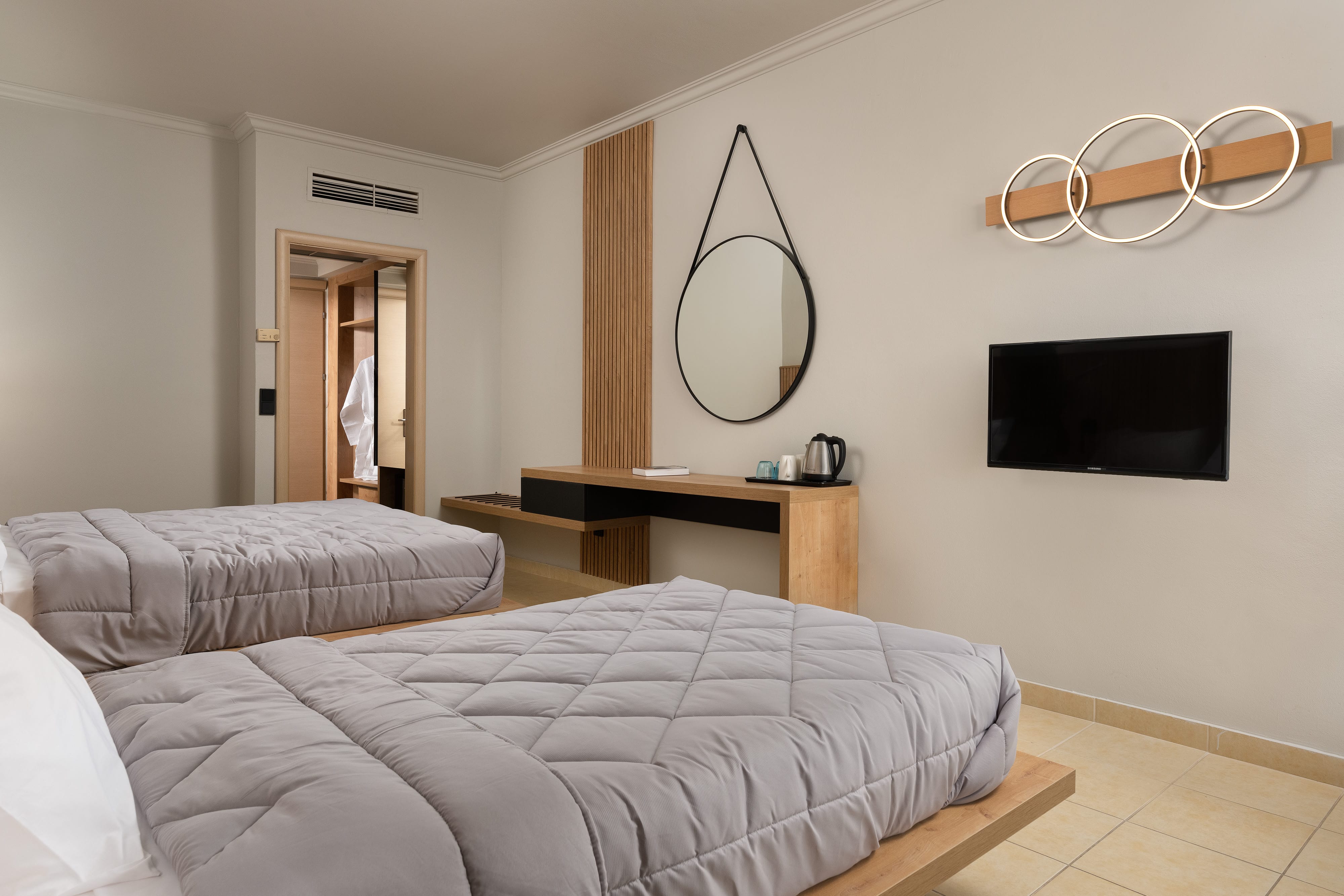 a bedroom with a tv and a bed