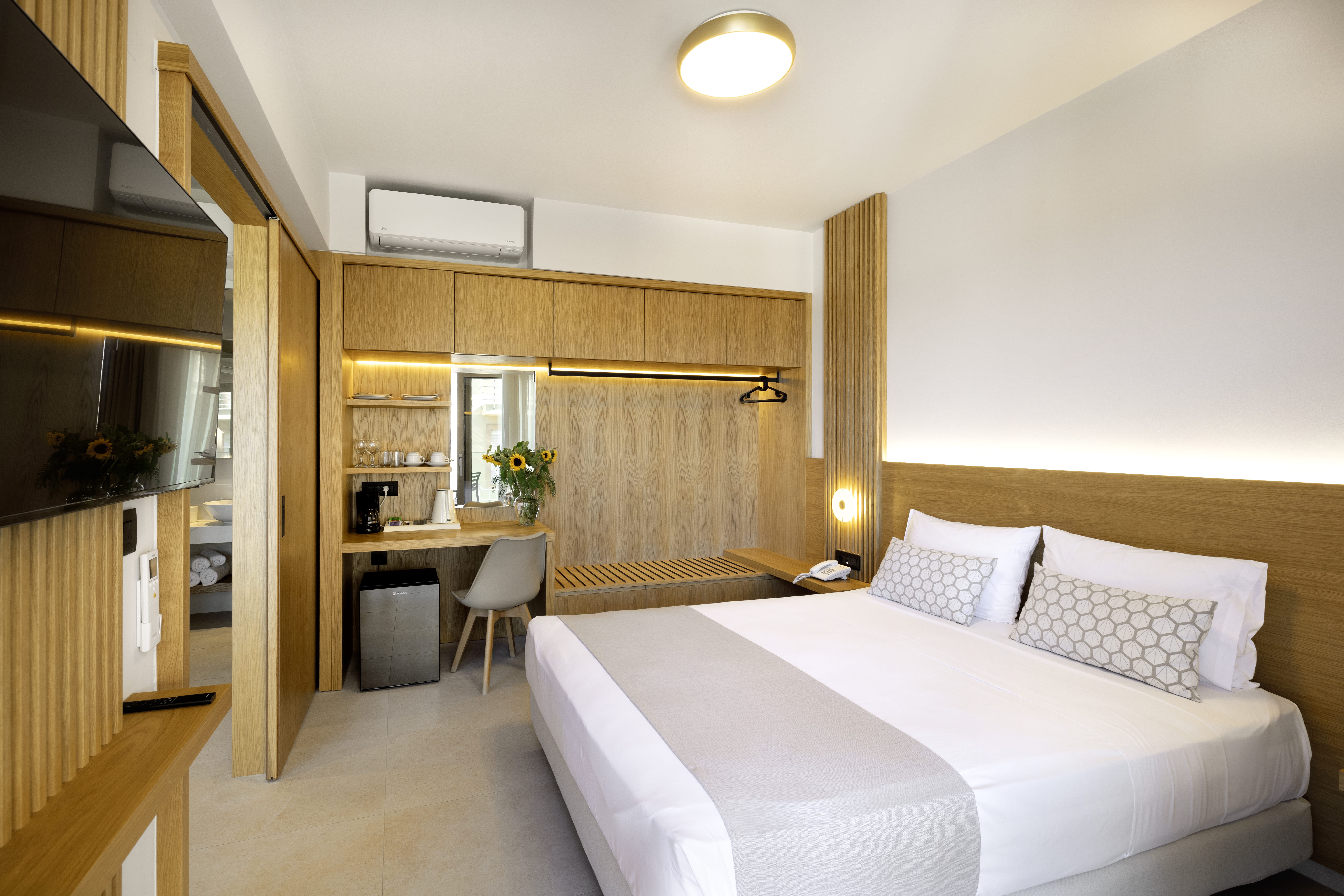 a bedroom with a bed and a desk