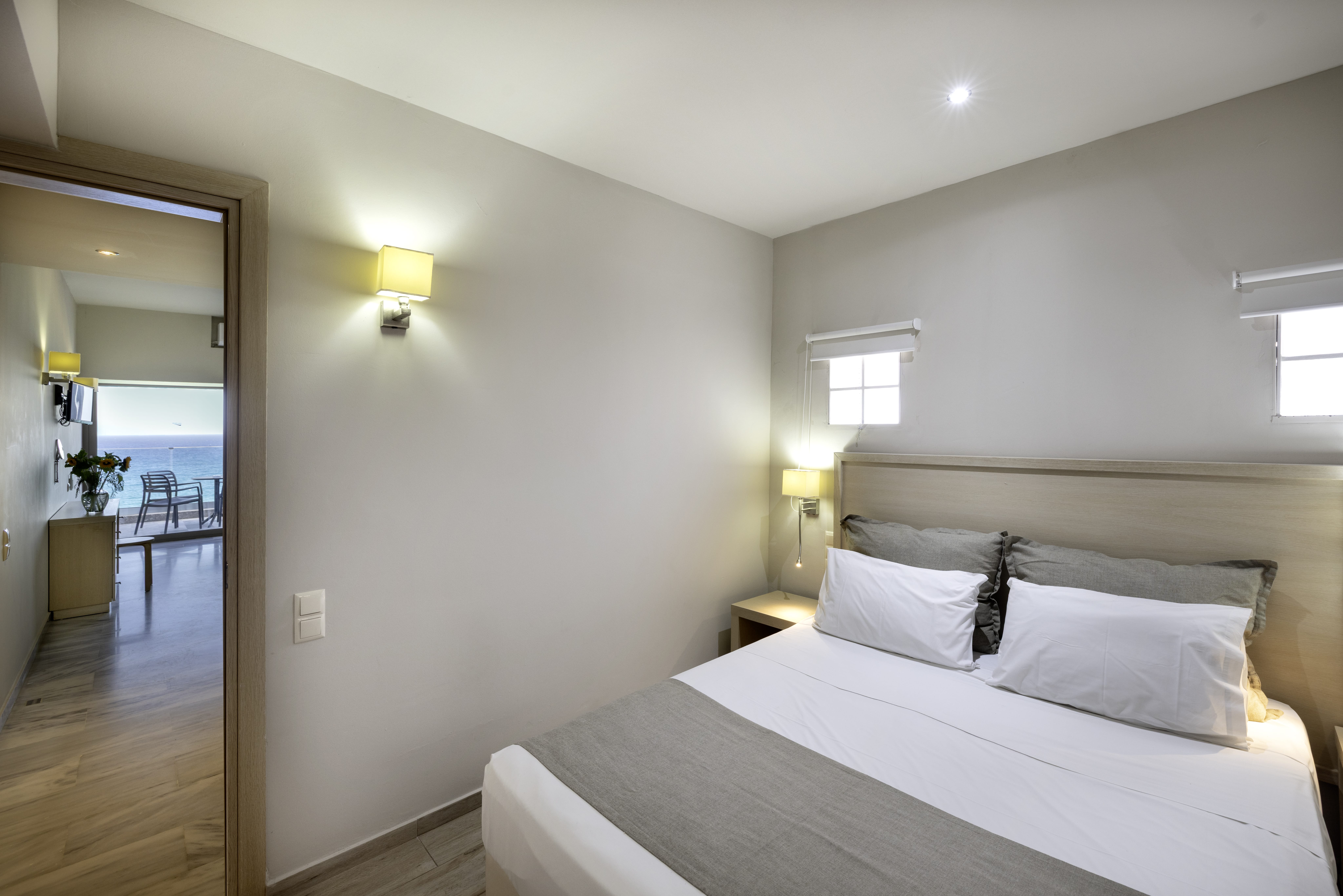 a bedroom with a bed and a mirror