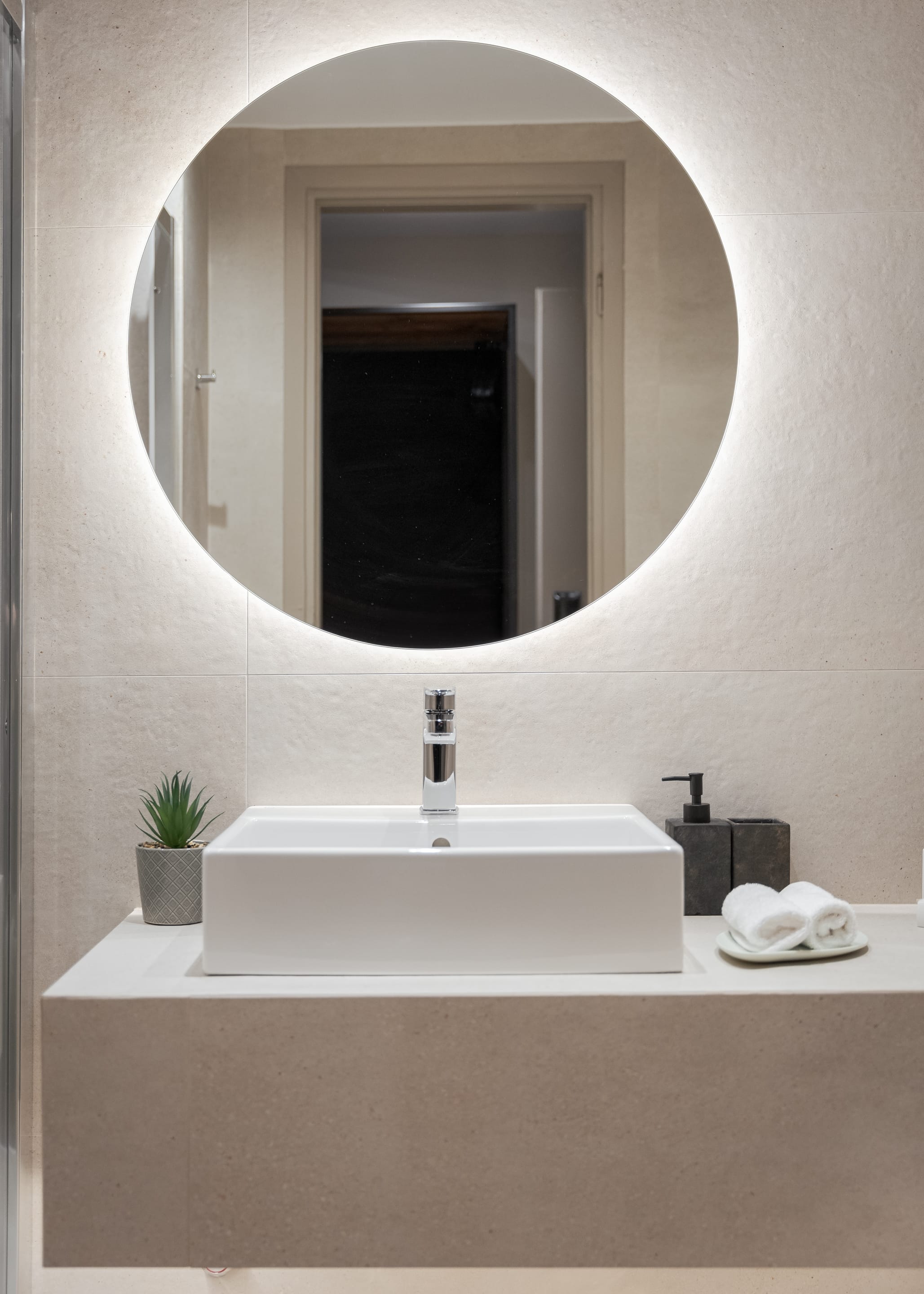 a bathroom with a large mirror