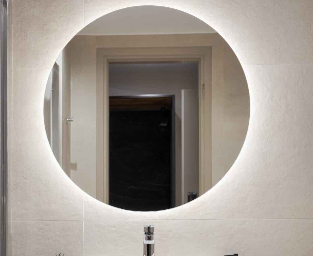 a bathroom with a large mirror