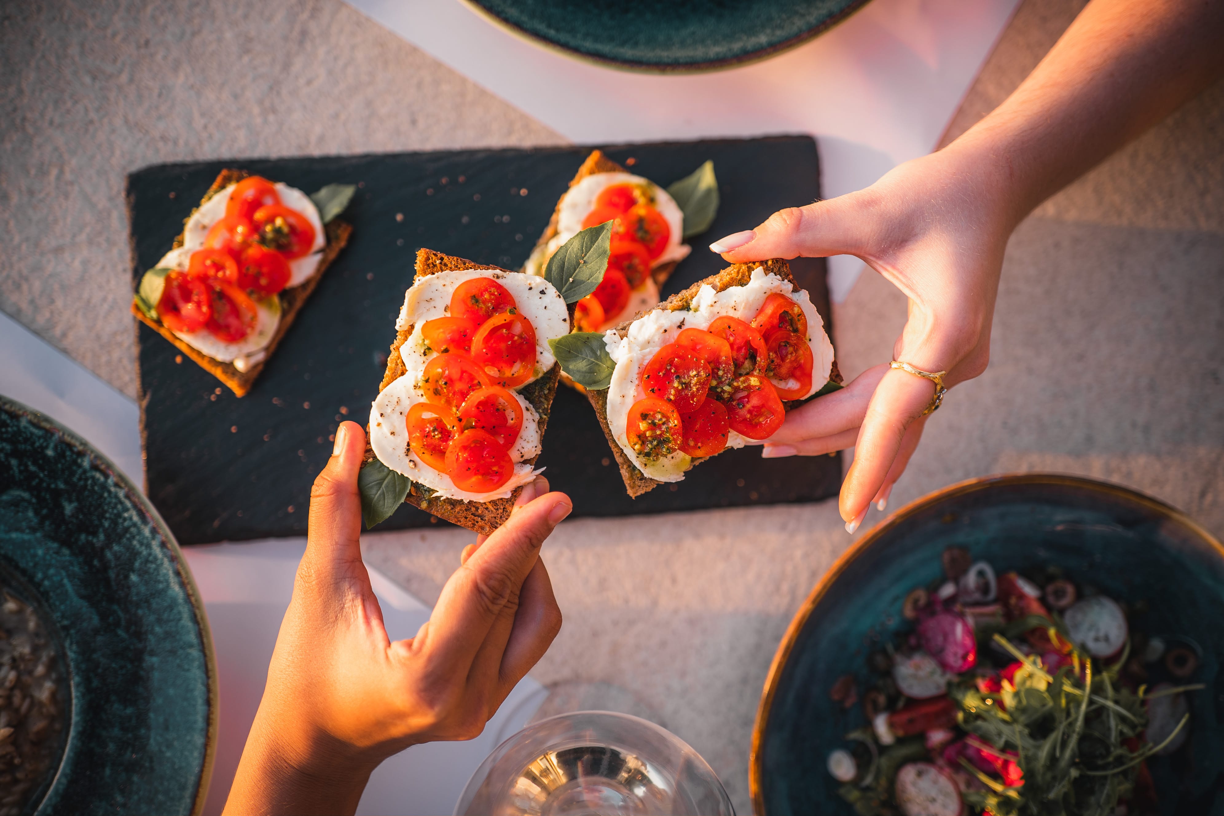 a person holding a plate of food