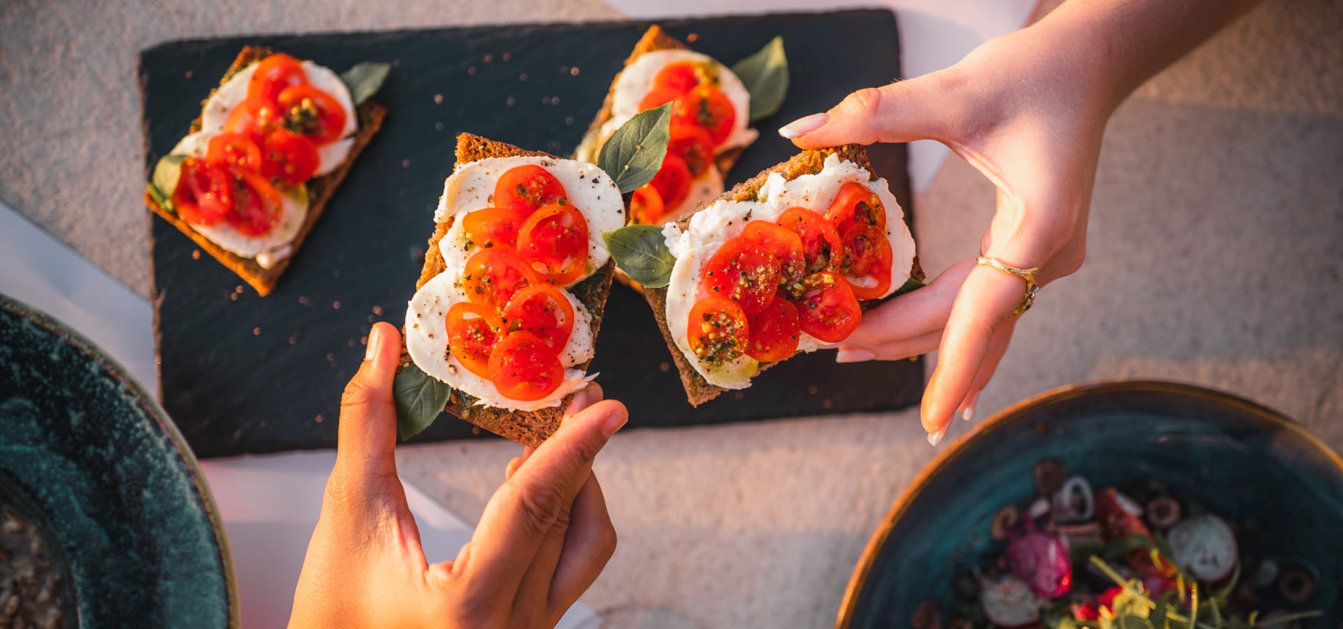 a person holding a plate of food