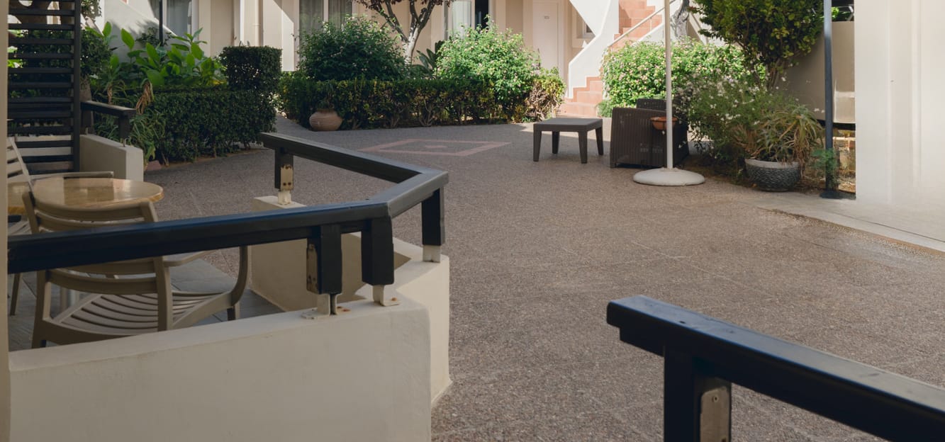 a patio with a table and chairs