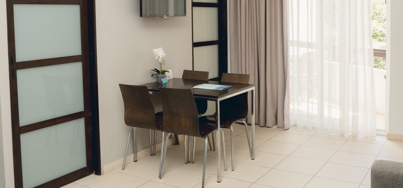 a room with a table and chairs