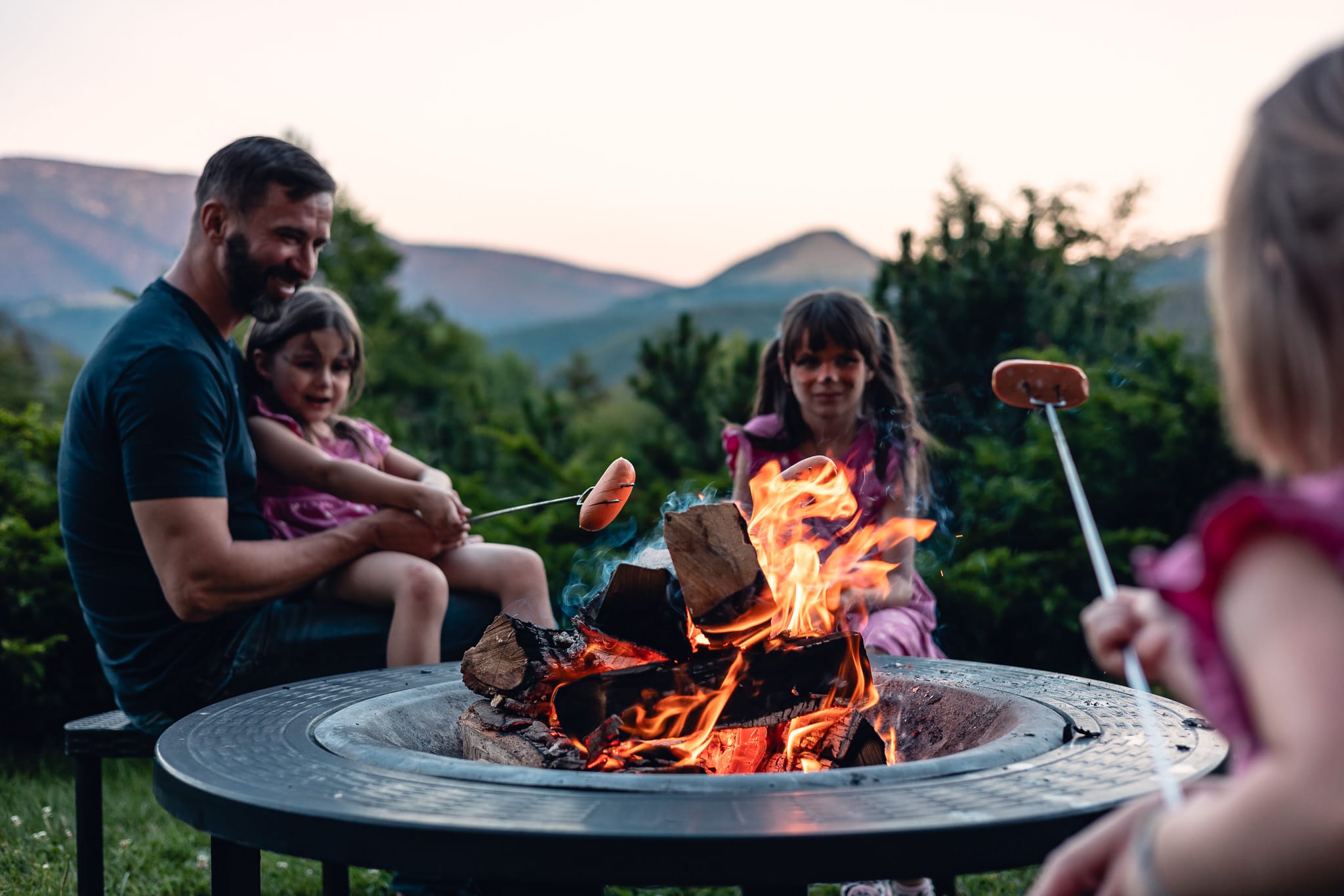 a group of people around a fire