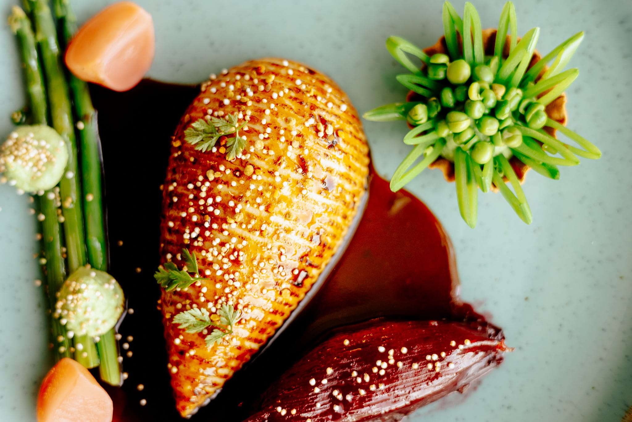 a hand holding a red pepper
