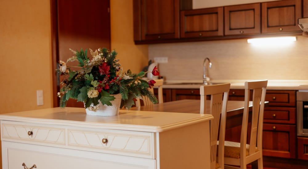 a kitchen with a table and chairs