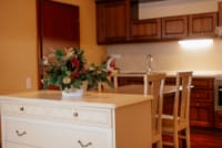 a kitchen with a table and chairs