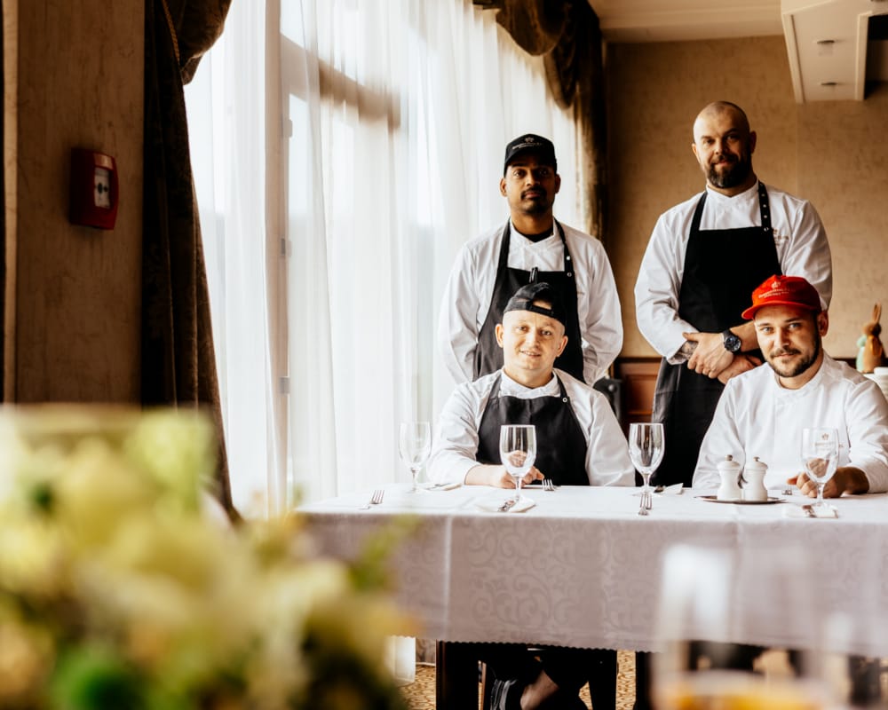 a group of men in aprons
