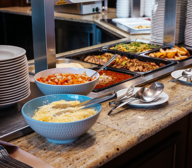 a counter with bowls of food on it