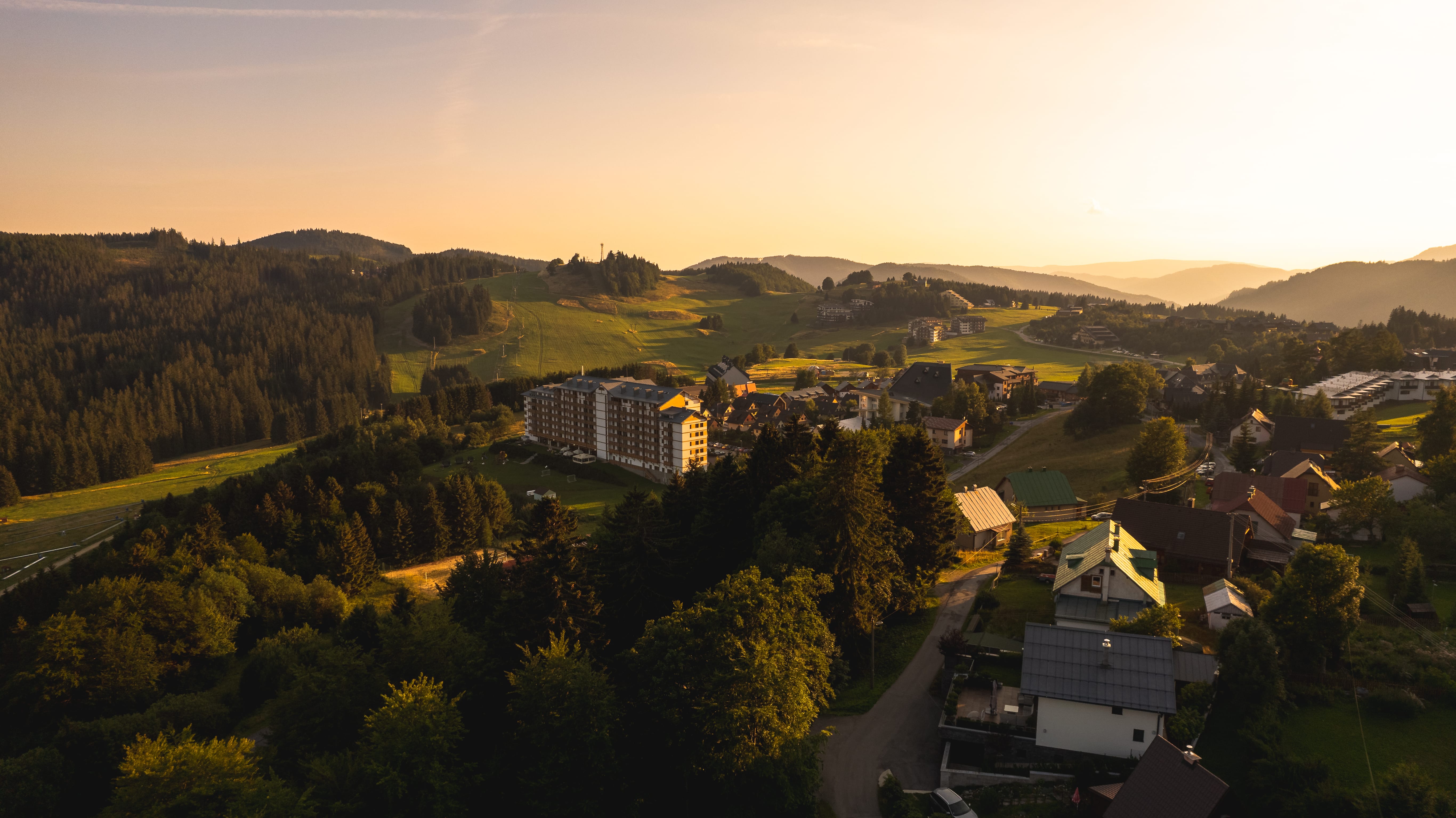 a landscape with trees and buildings