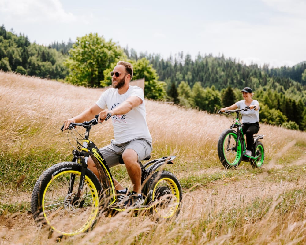 a man and a boy riding bikes