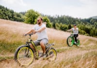 a man and a boy riding bikes
