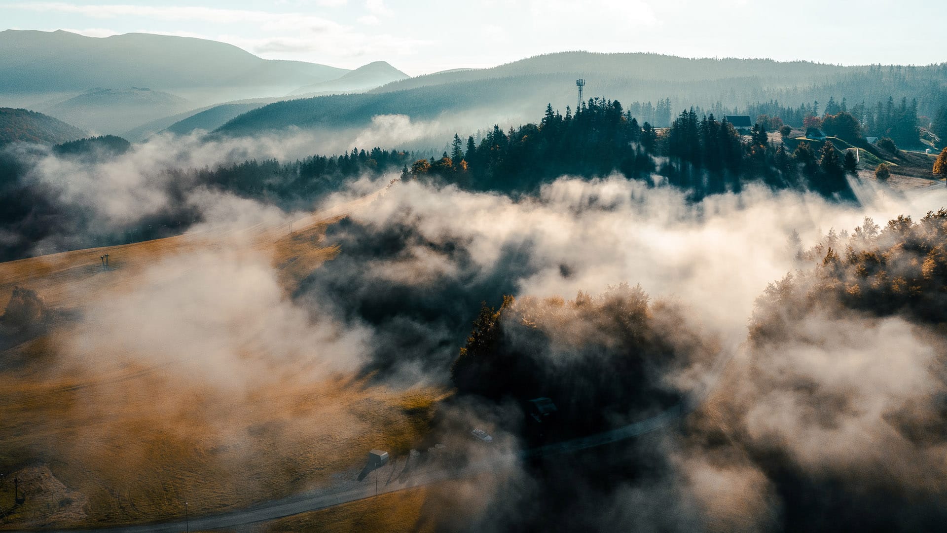 a view of the clouds and mountains
