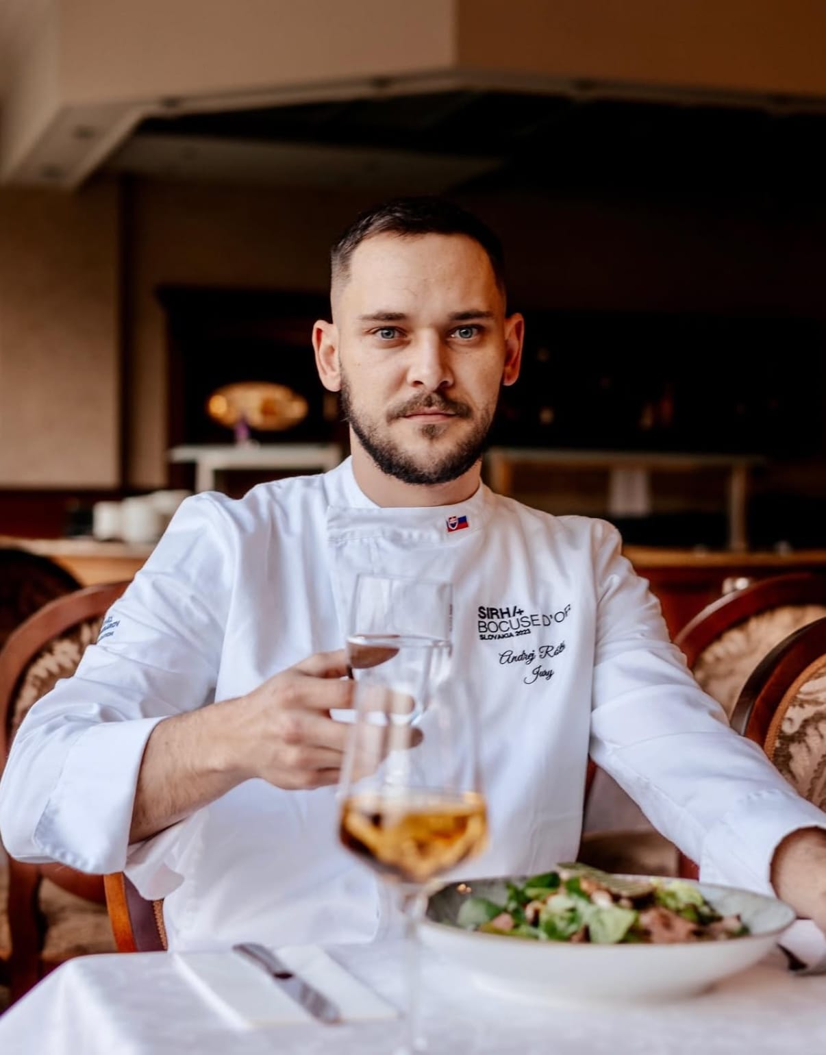 a man holding a glass of wine