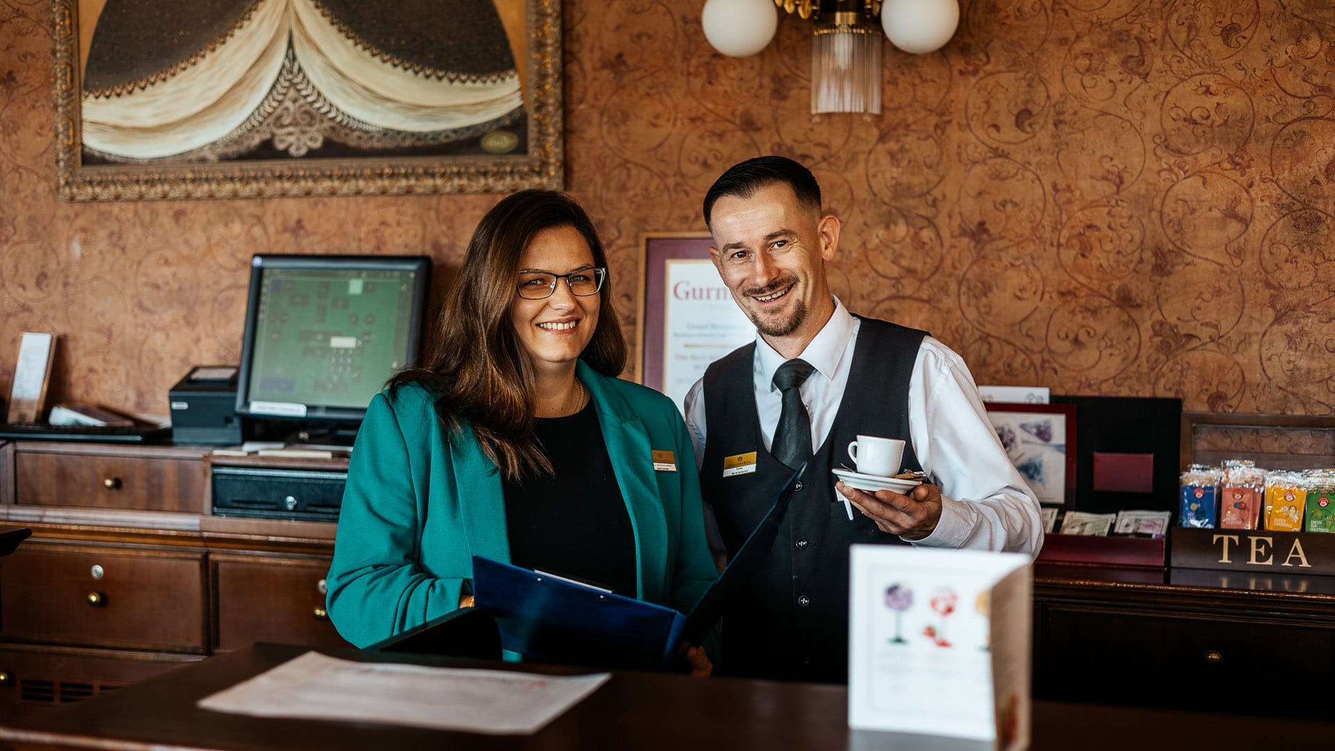 a man and a woman holding cups