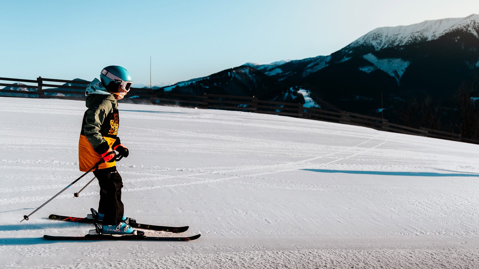 a kid skiing on the snow