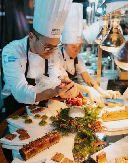 a couple of chefs preparing food
