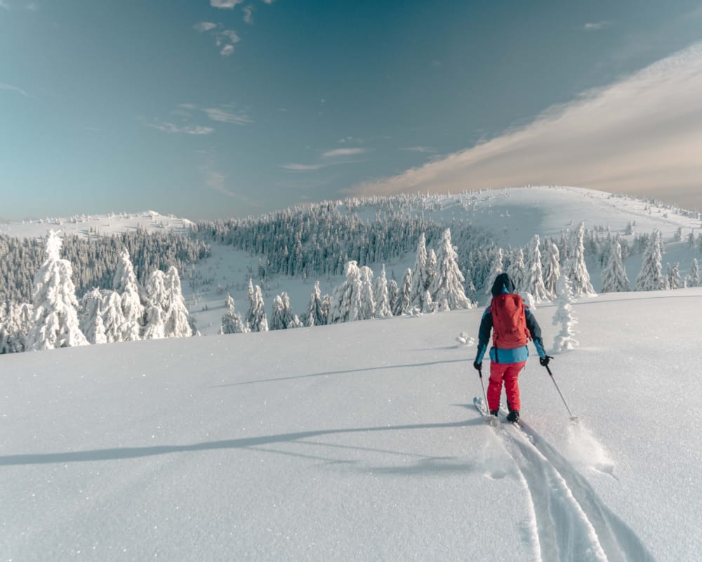 a person skiing on the snow
