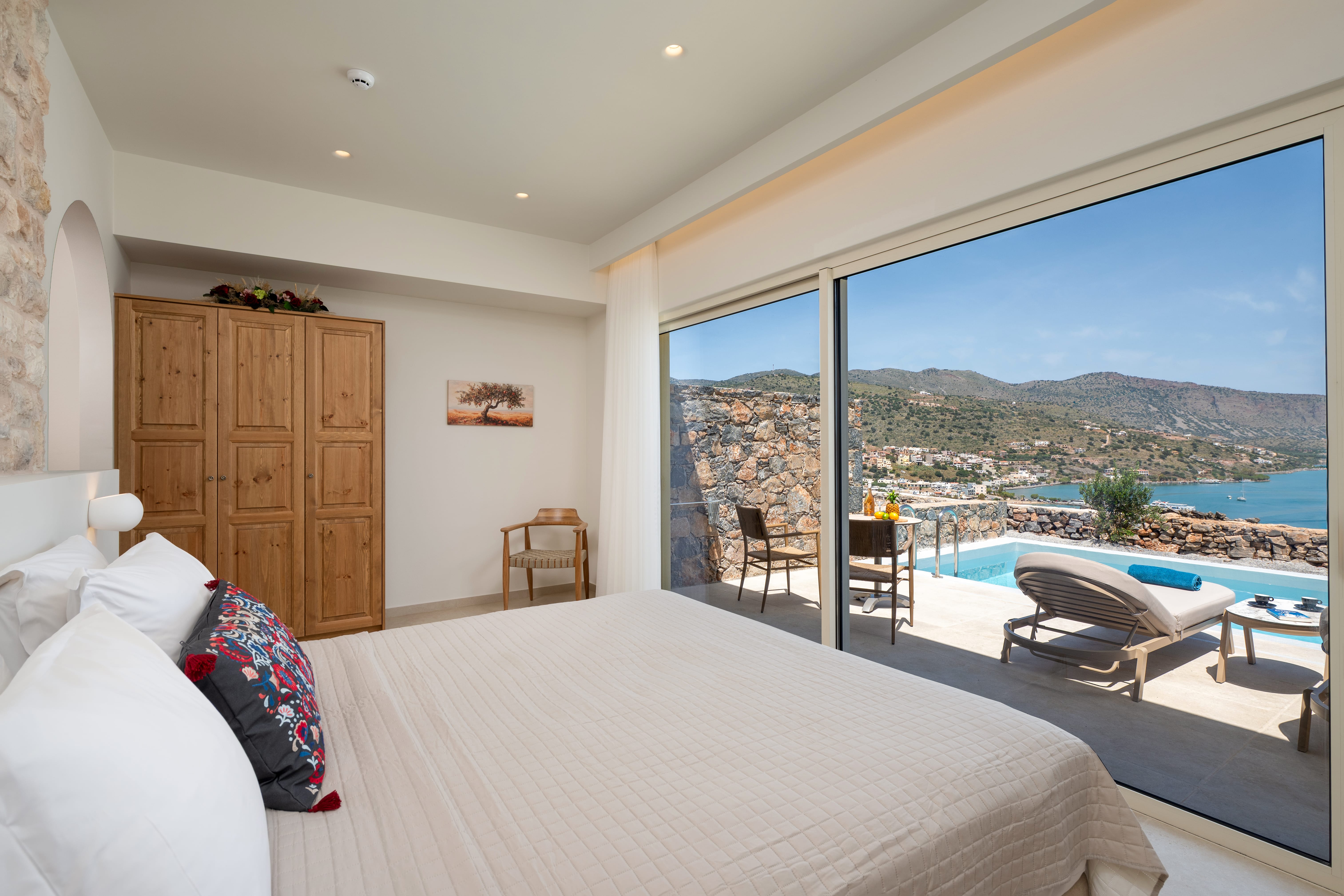 a bedroom with a pool and a bed