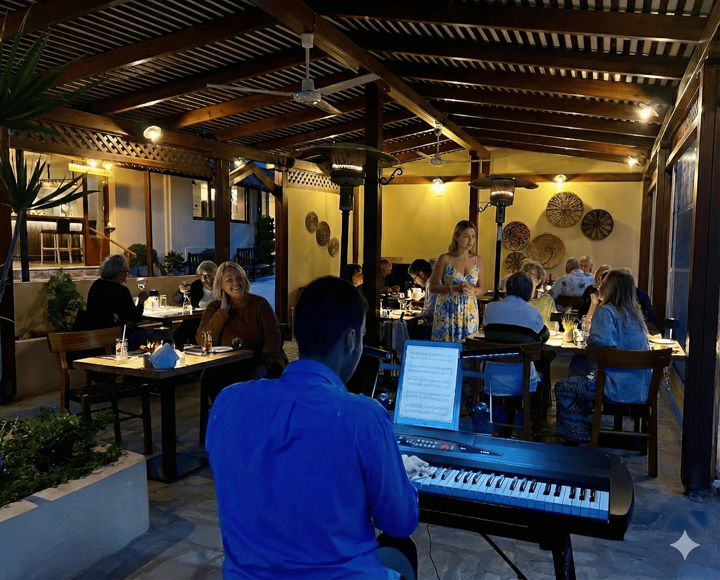 people sitting at tables in a restaurant