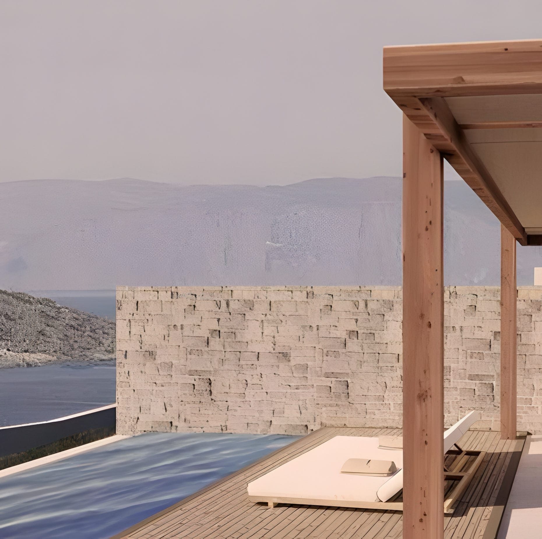 a table and a chair on a deck overlooking a body of water