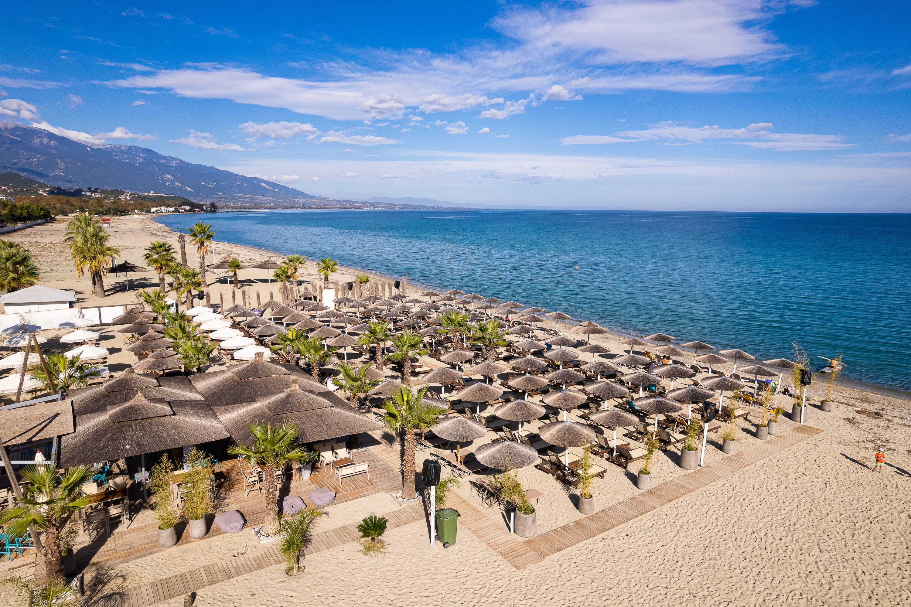 a beach with many umbrellas