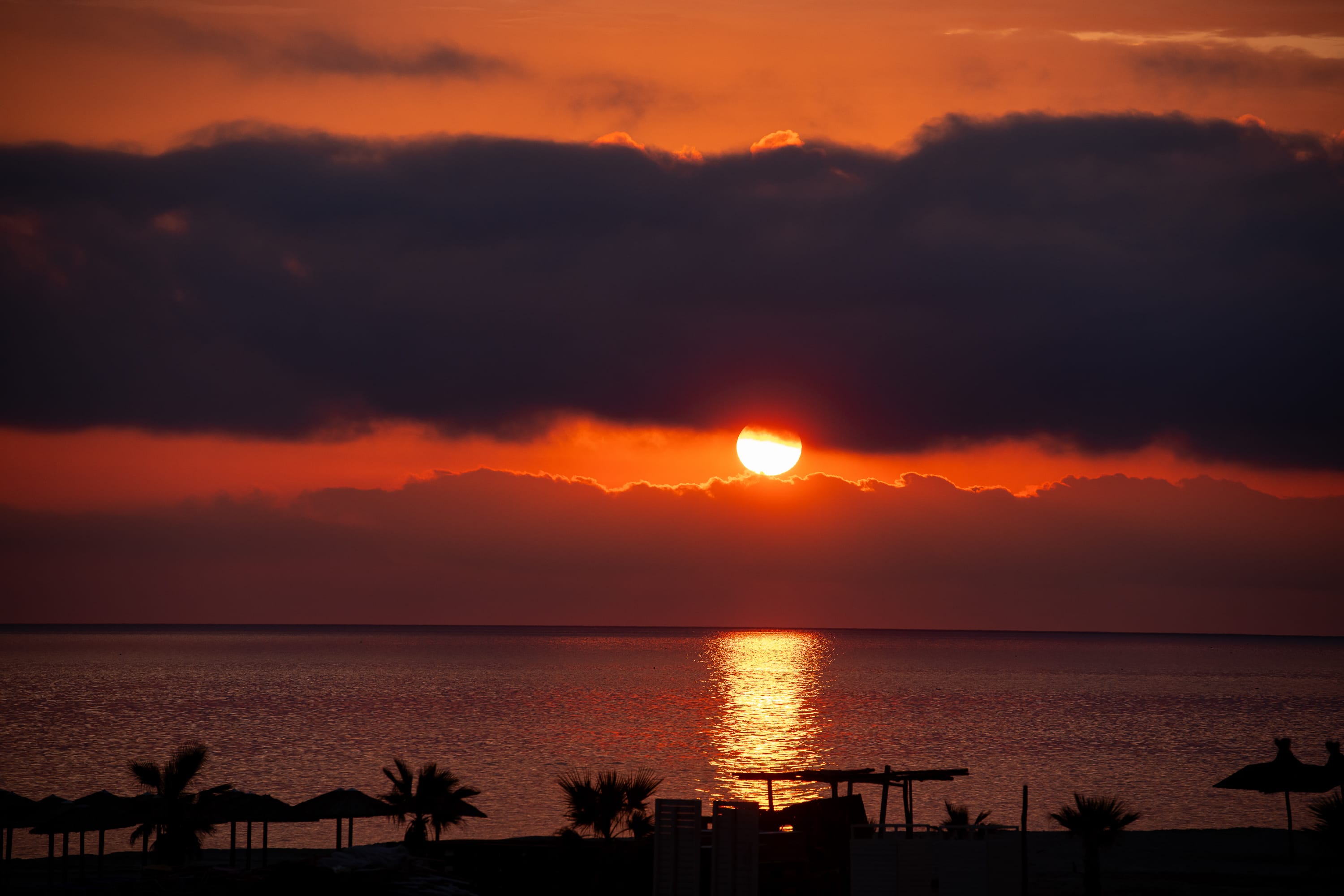 a sunset over a beach