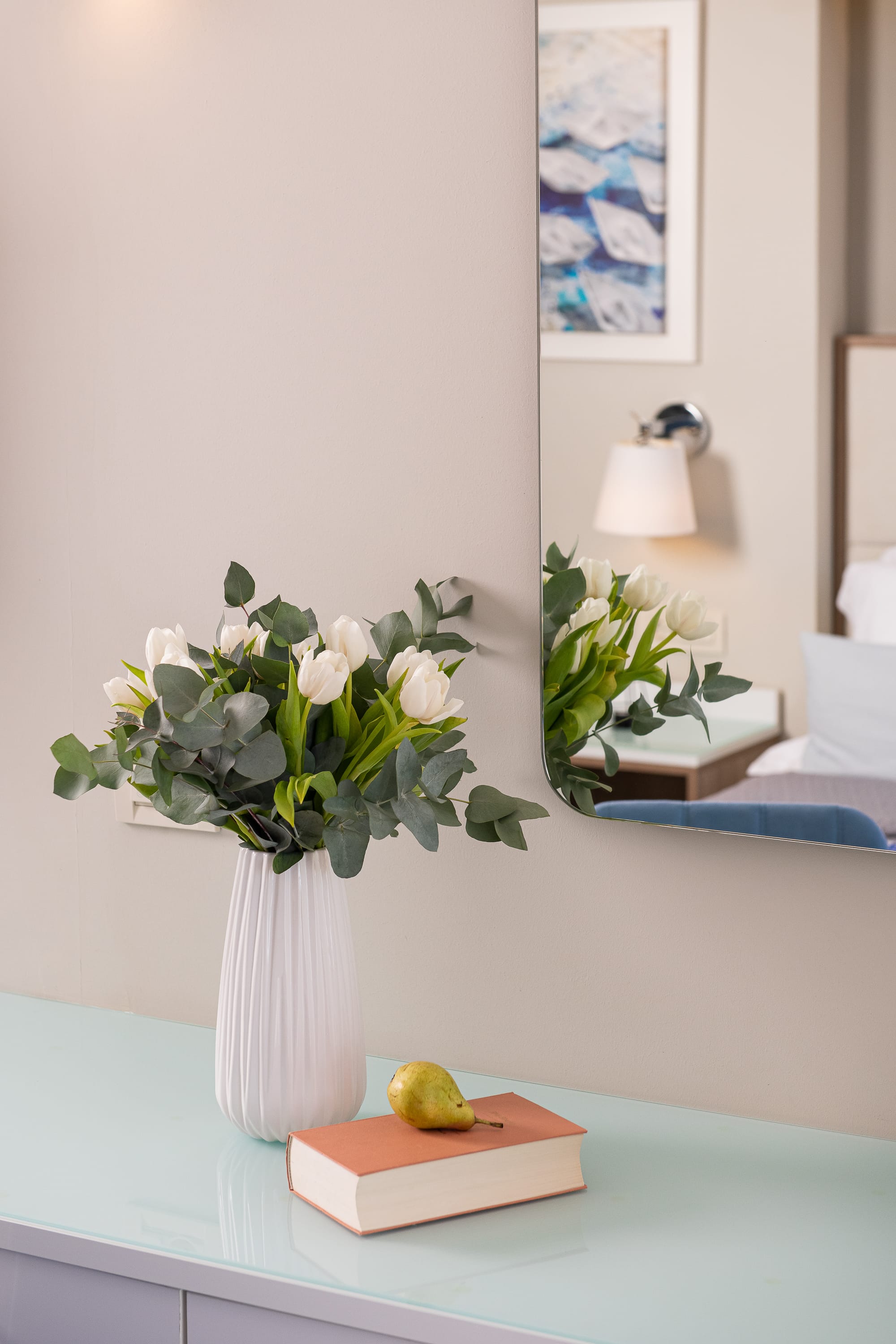 a vase with white flowers