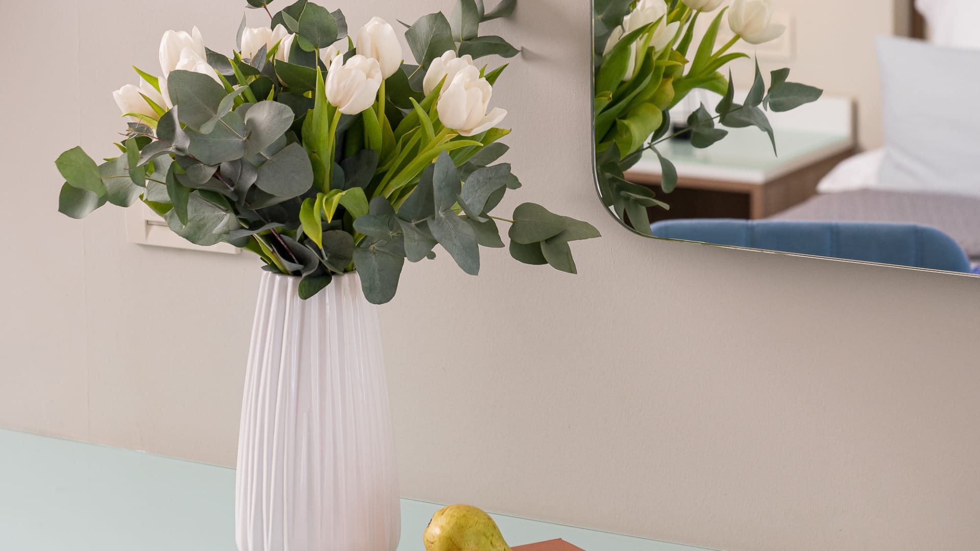 a vase with white flowers