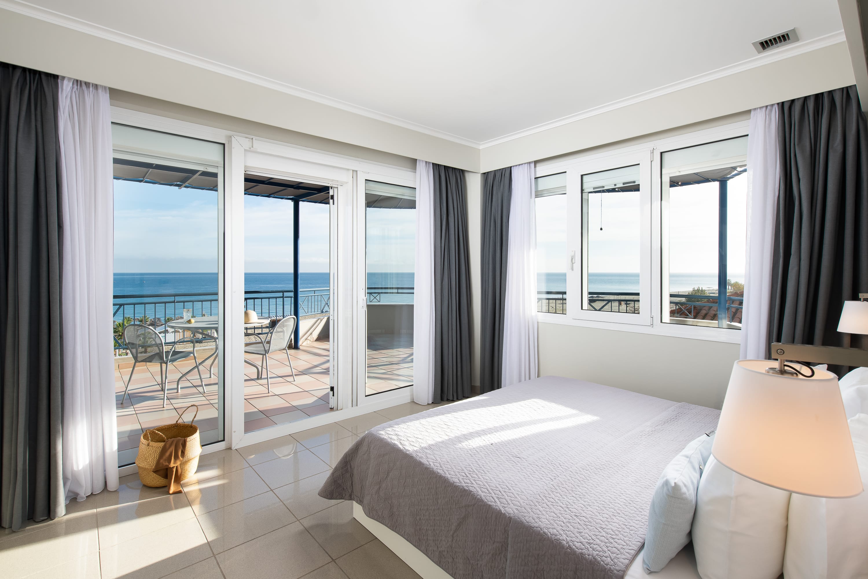 a bedroom with a large window