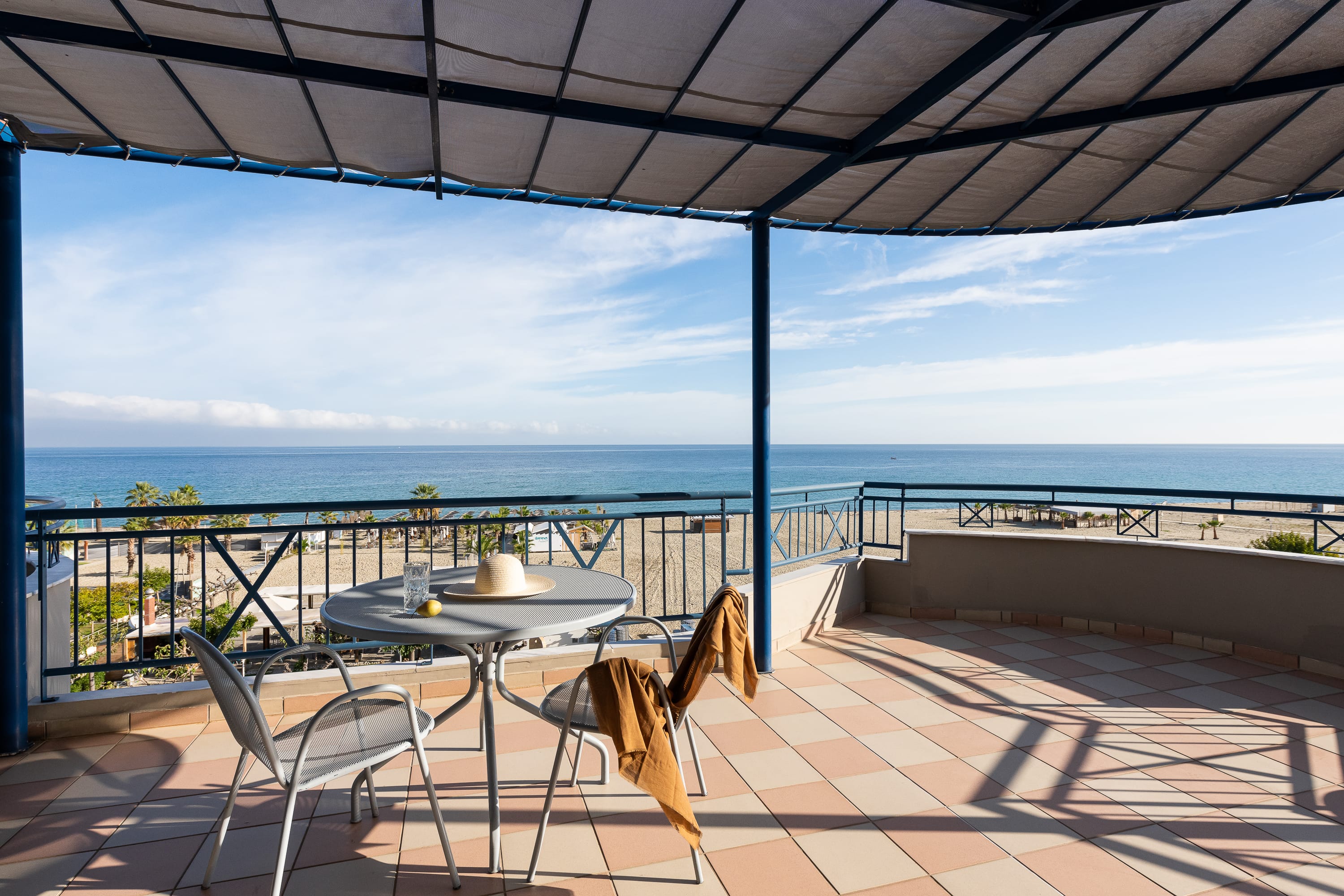 a table and chairs on a deck