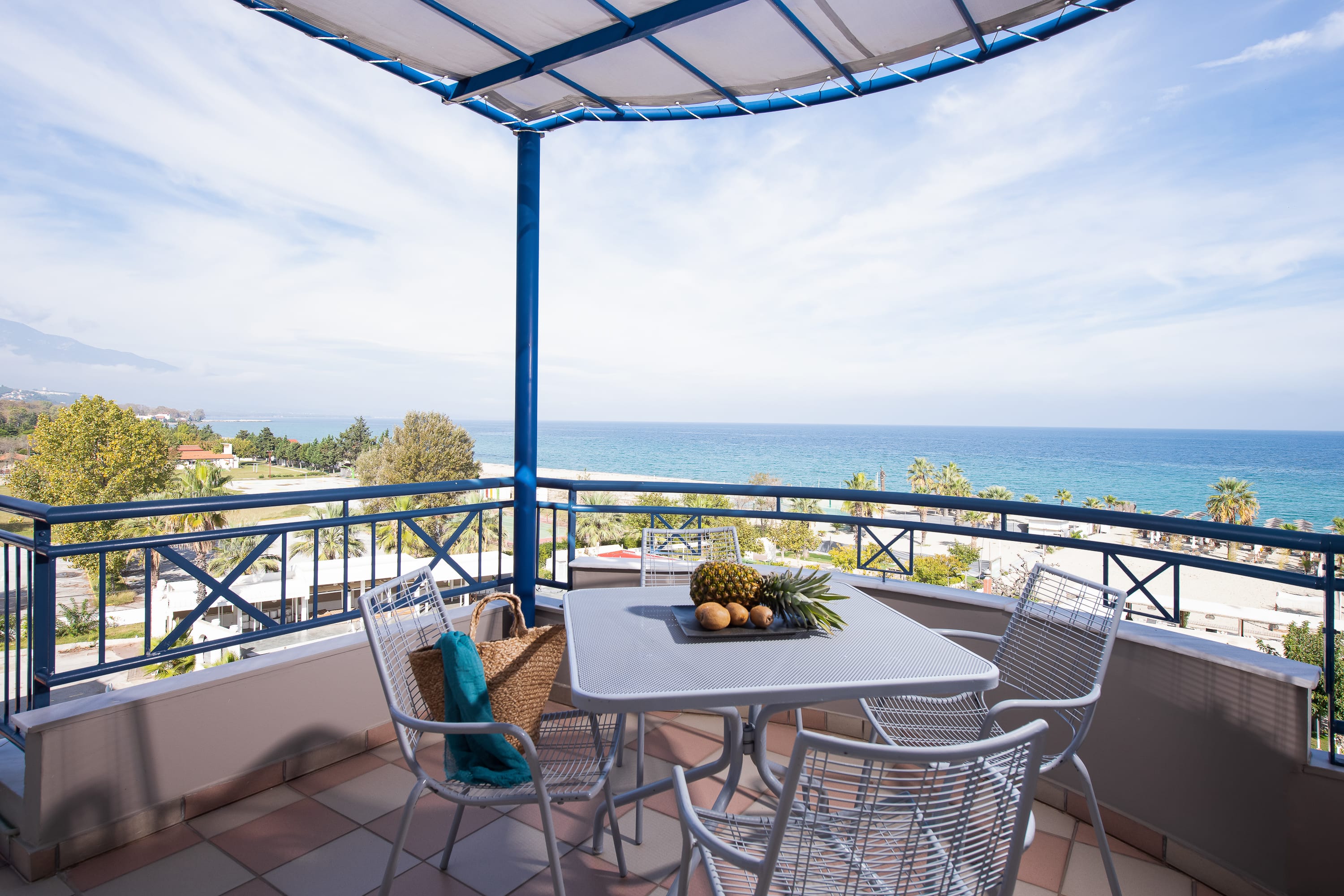a table and chairs on a deck